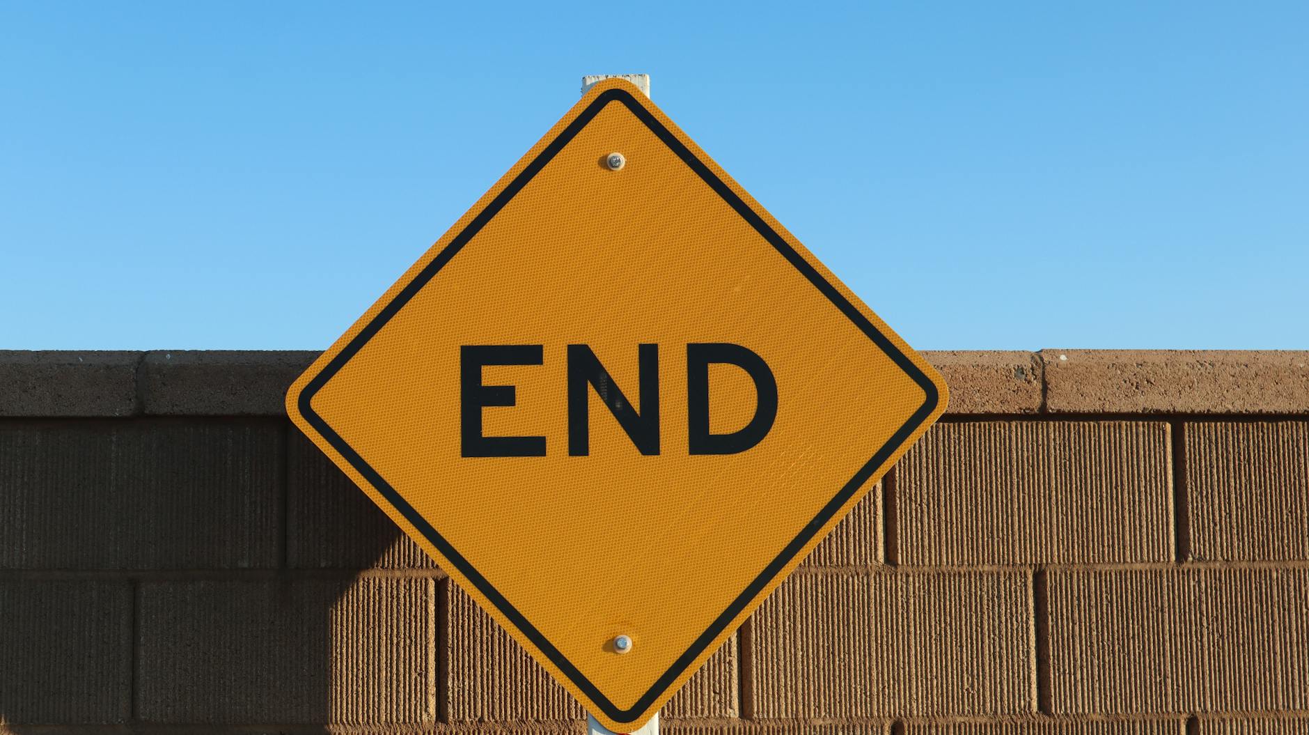 end sign against a brick wall in elk grove